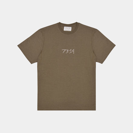 Olive, military green hemp t-shirt. Front view. White 7319 embroidered logo across front. Organic hemp clothing. Sustainable street style. 