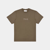Olive, military green hemp t-shirt. Front view. White 7319 embroidered logo across front. Organic hemp clothing. Sustainable street style. 