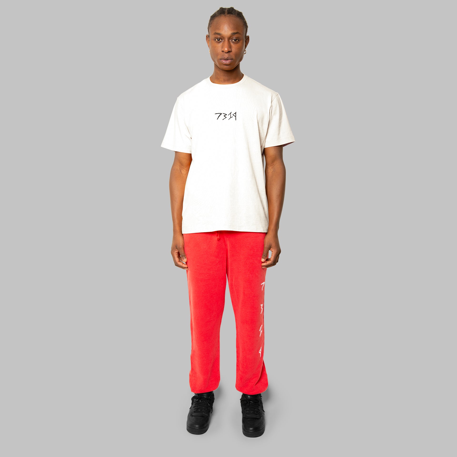 Complete set, white hemp t-shirt and red hemp sweatpants. Red hem joggers white 7319 logo embroidered down leg. White hemp t-shirt with black 7319 logo across front.