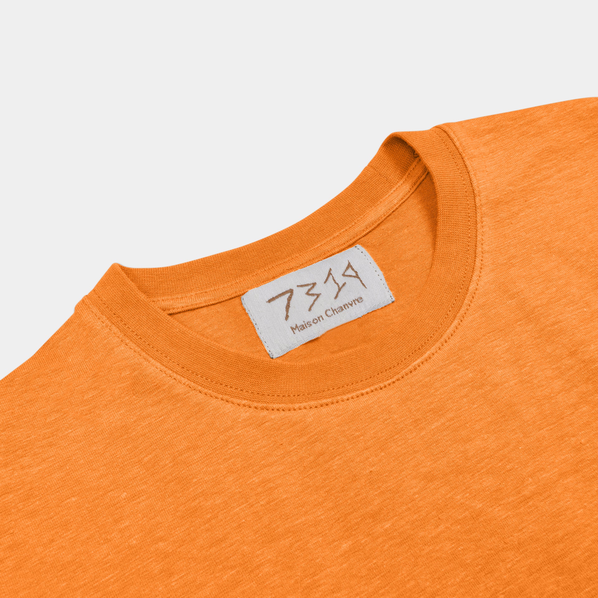 Saffron Orange 7319 t-shirt front shot with label, flipped
