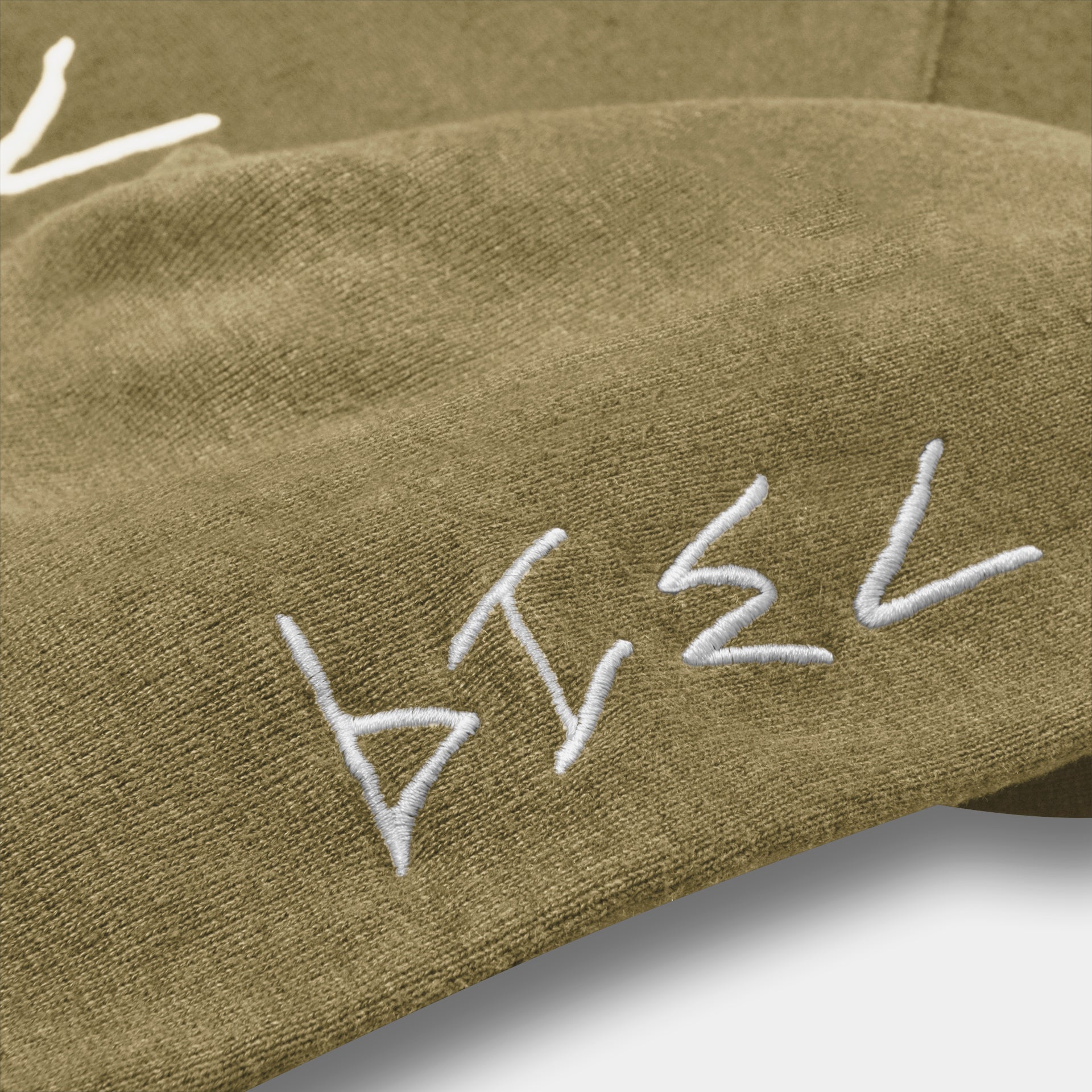 Olive 7319 hemp hoodie zoomed into stitching/embroidery. High quality sustainable material. 