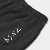 black hemp joggers. Zoom in shot of back pocket. White embroidered 7319 logo on pocket.