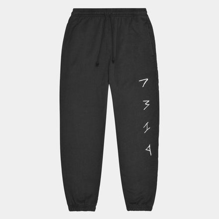 Black hemp sweatpants. White 7319 logo stitched down leg. Hemp sustainable clothing. Zero waste.